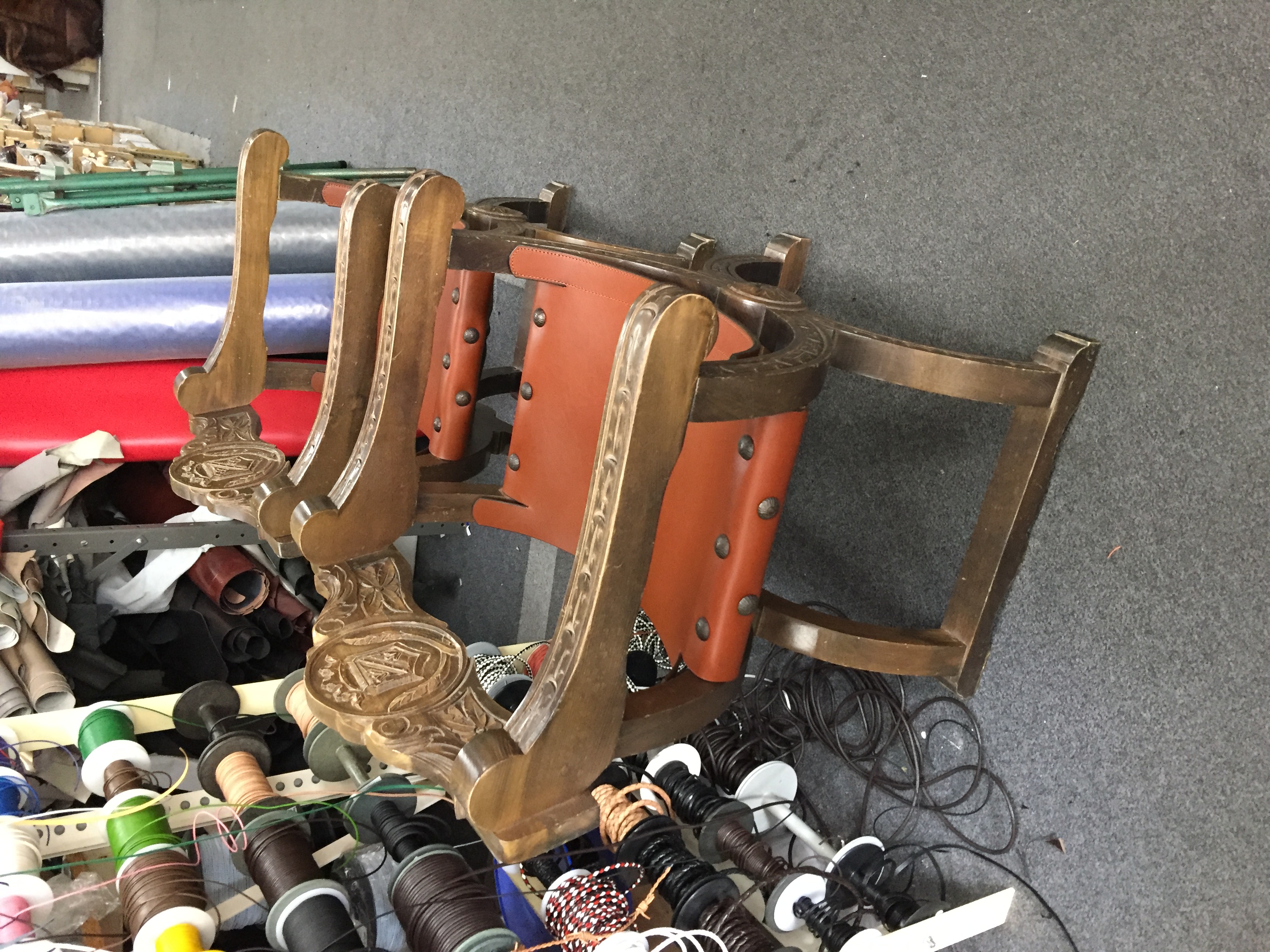 Antique carved chairs with leather seats - side view