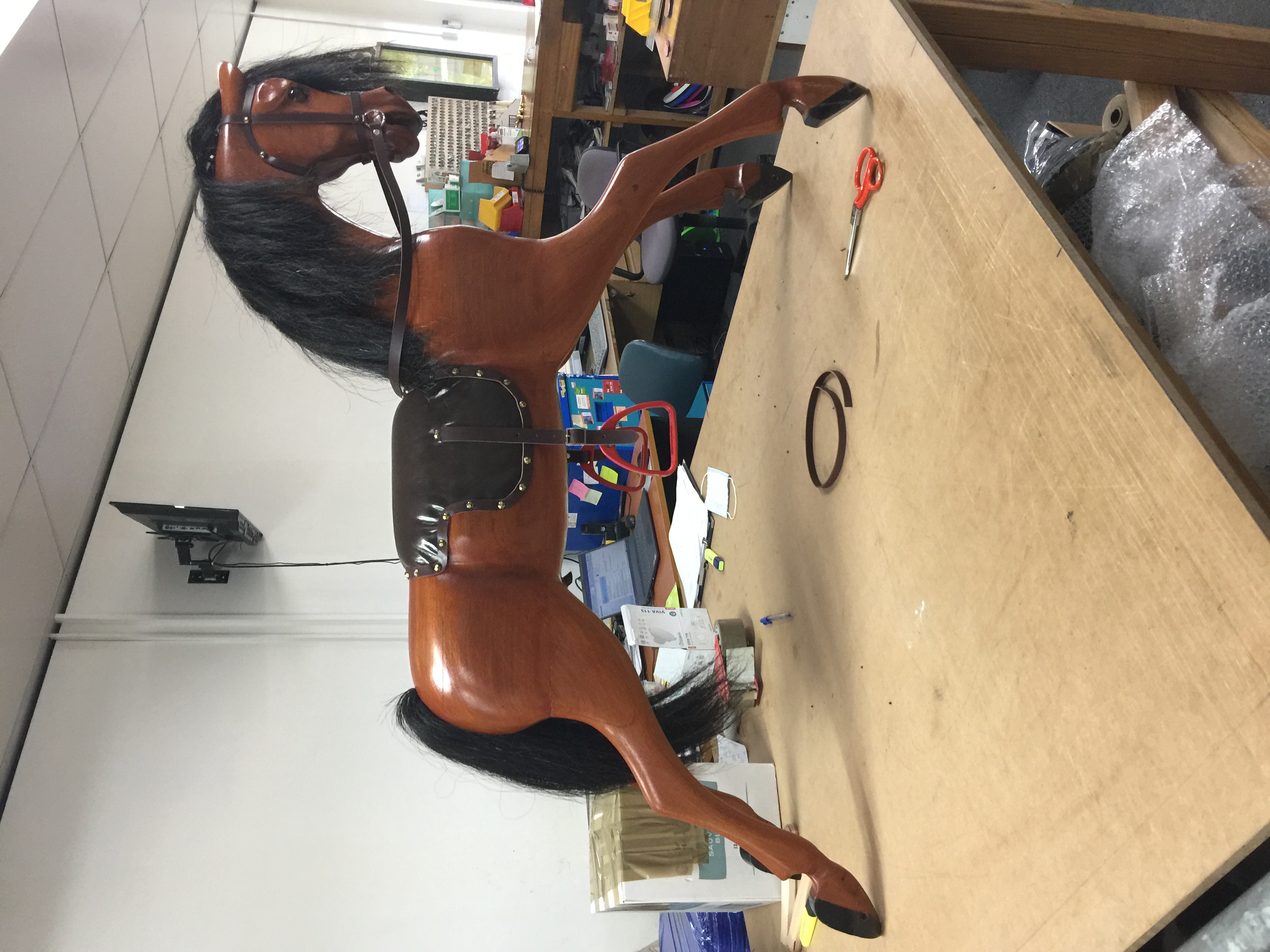 Rocking horse leather saddle restoration in progress